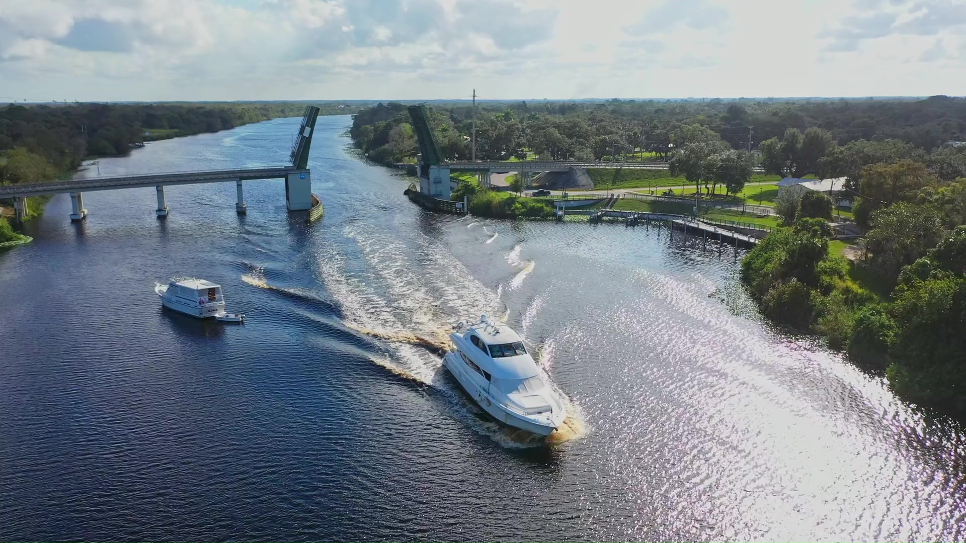 yacht on river with drawbridge